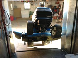 Riding Mower in Mobile Lawn Mower Repair Trailer - 1